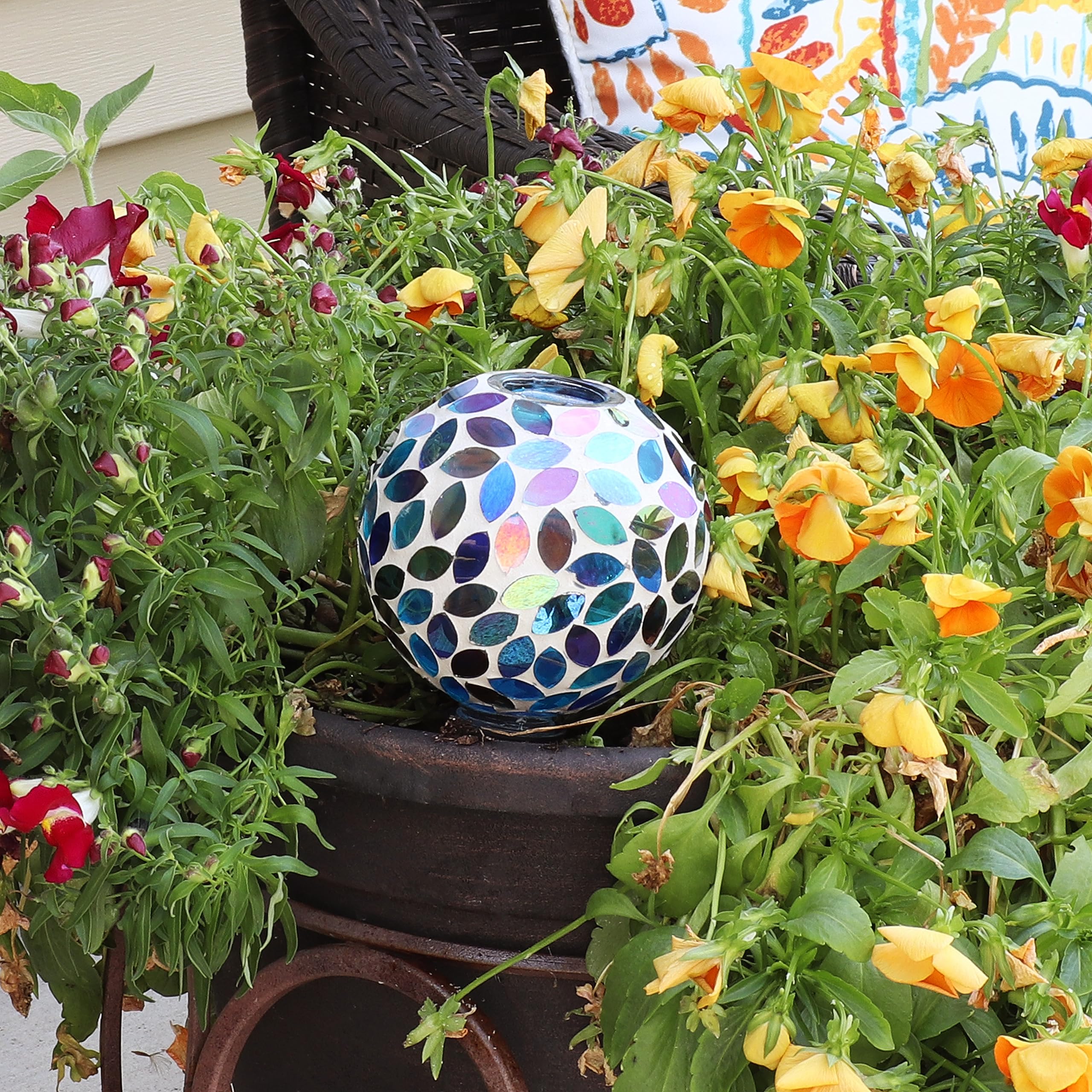Sunnydaze globe inserted in small pot demonstrating neat self-watering and plant support