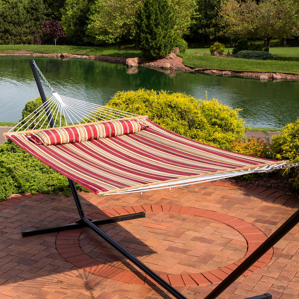 Sunnydaze hammock hung between trees demonstrating outdoor placement options