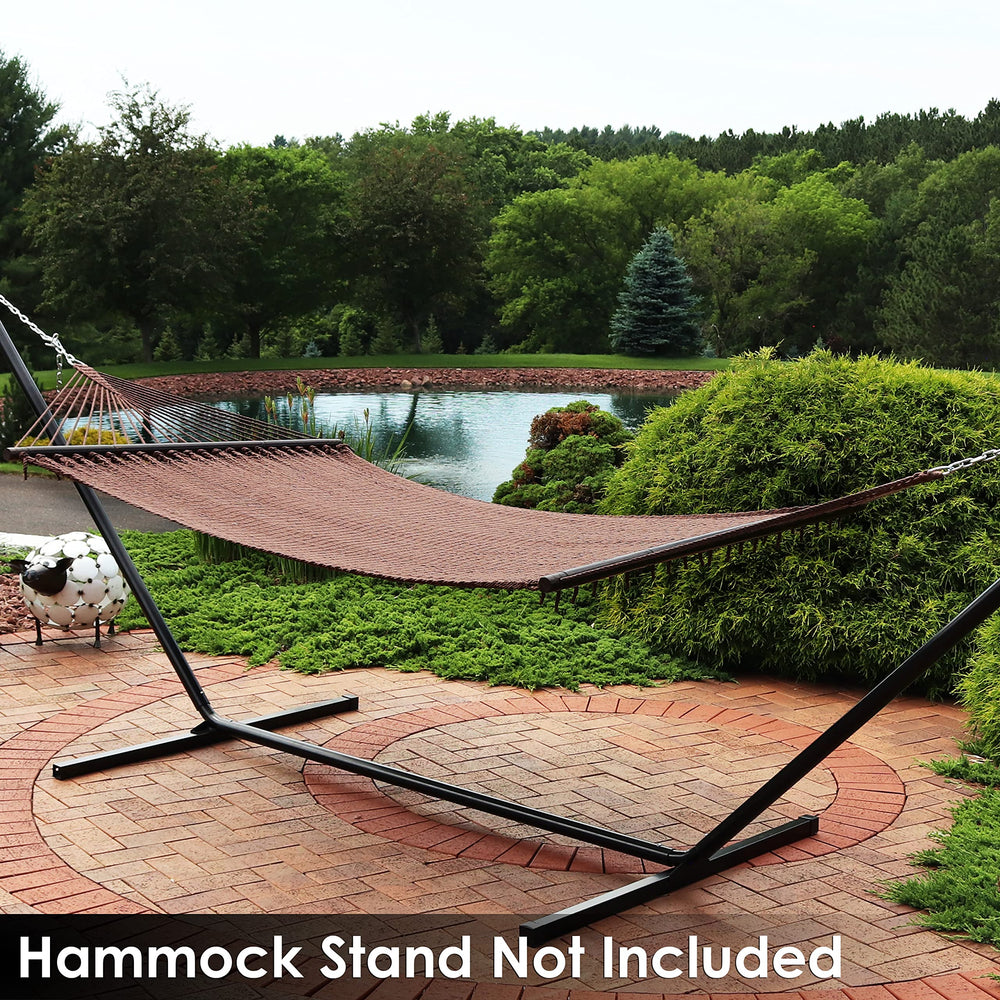Sunnydaze Decor lifestyle backyard scene with hammock, showcases stylish outdoor relaxation