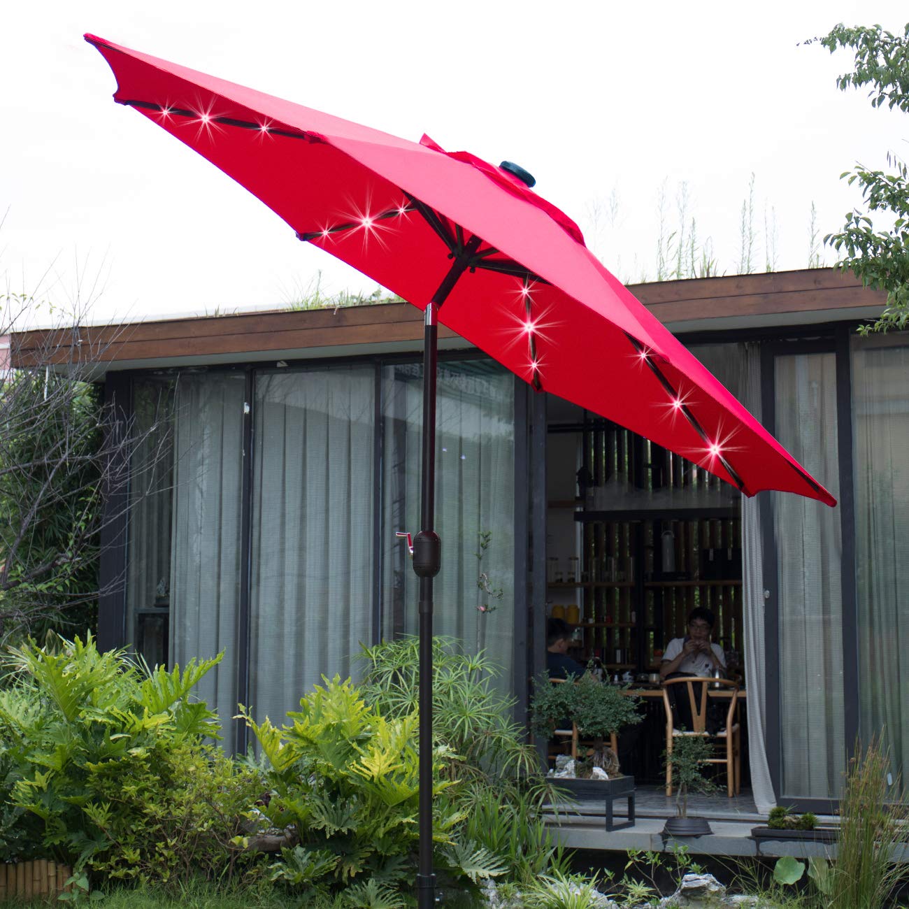 Sunnyglade umbrella over table and chairs showing size and shading capacity benefit