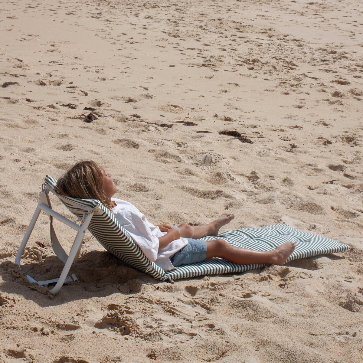 Sunnylife Vacay Olive side profile on sand illustrating low chaise stability and beach use