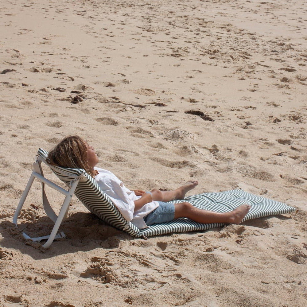 Sunnylife Vacay Olive side profile on sand illustrating low chaise stability and beach use