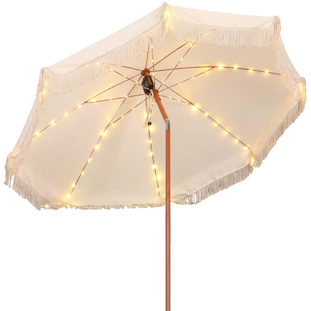 Sunnymove umbrella front view showing boho fringe and full shade benefit