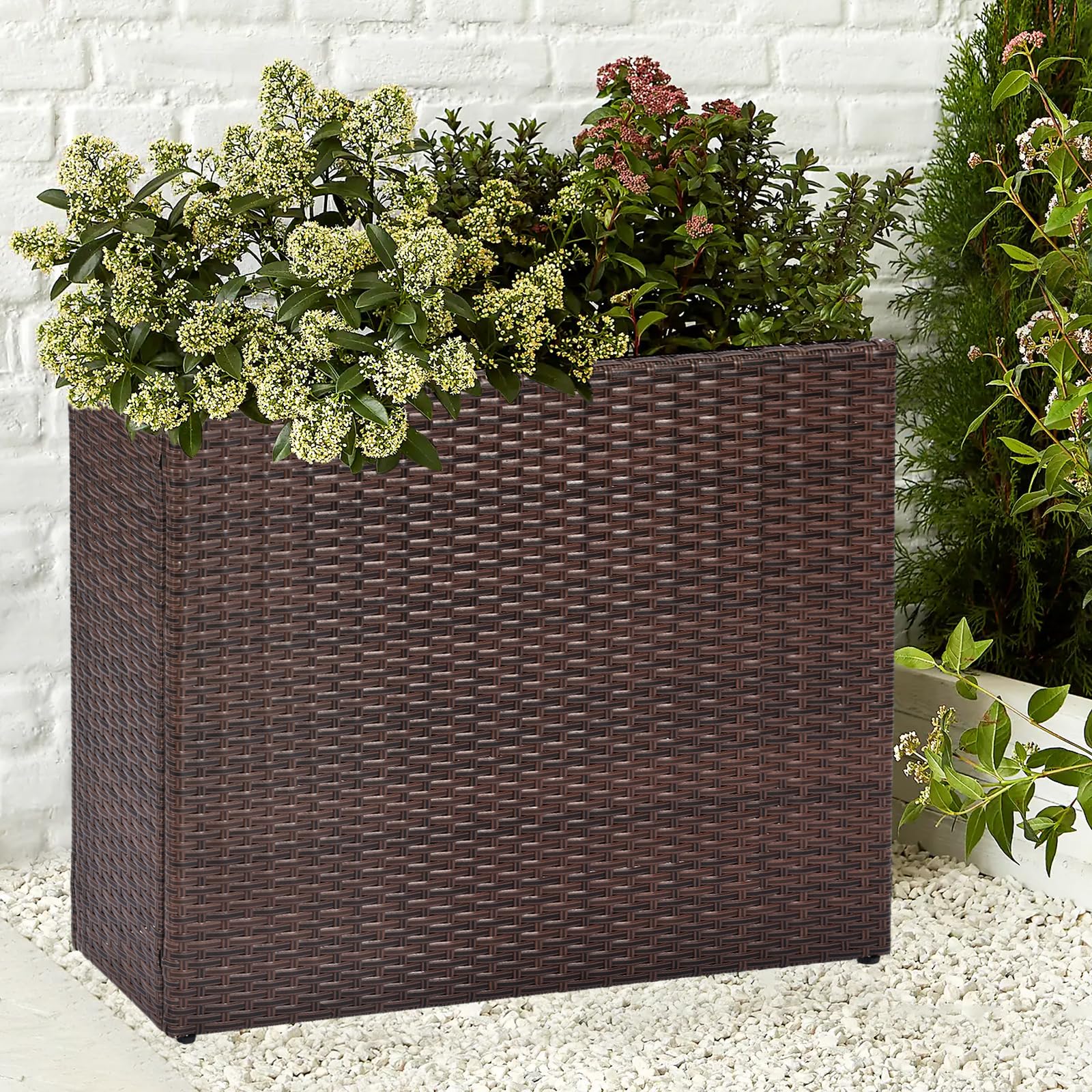 SUNNYPARK planter next to chair showing scale and how it fits narrow outdoor spaces