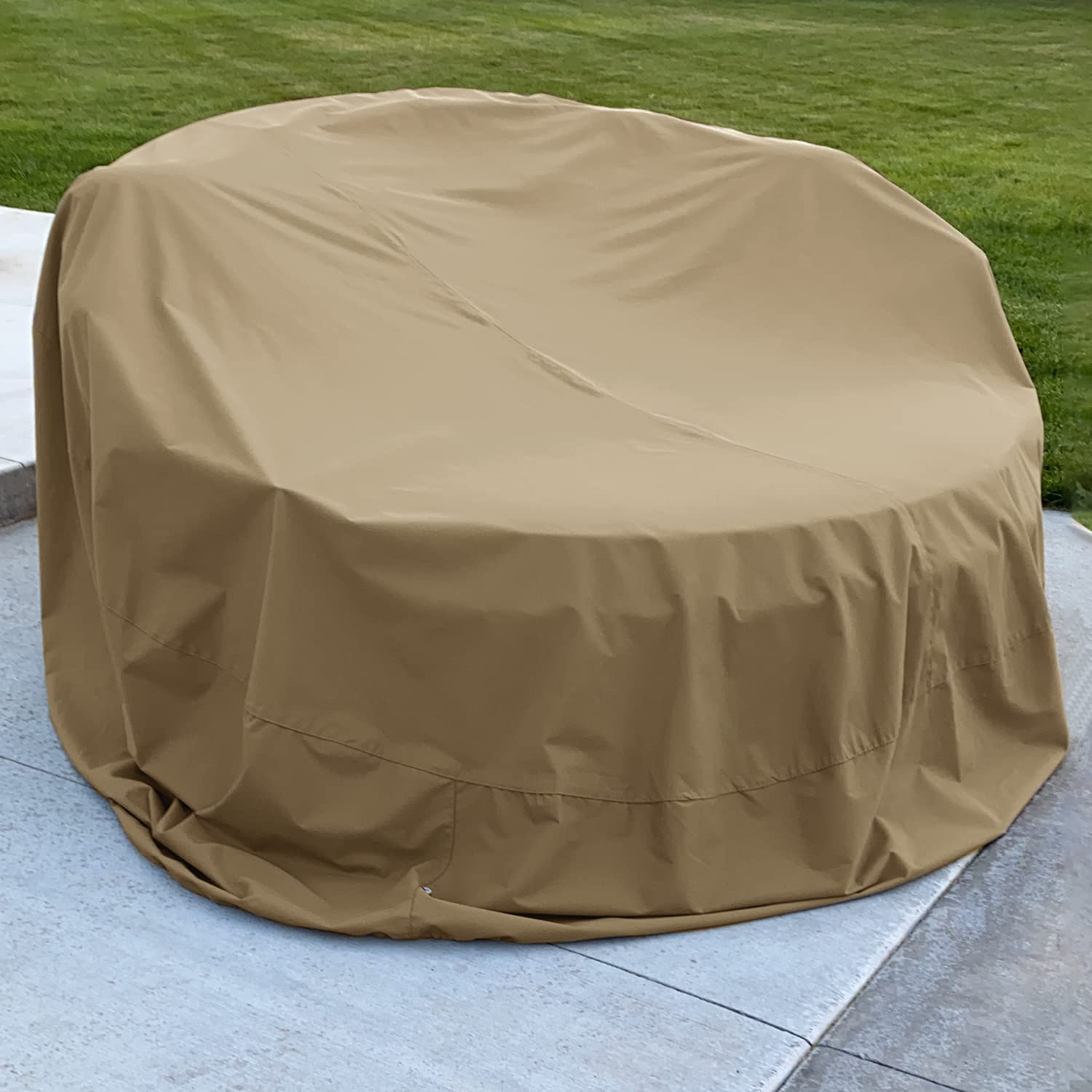 SunPatio cover beside chair for scale demonstrating coverage size