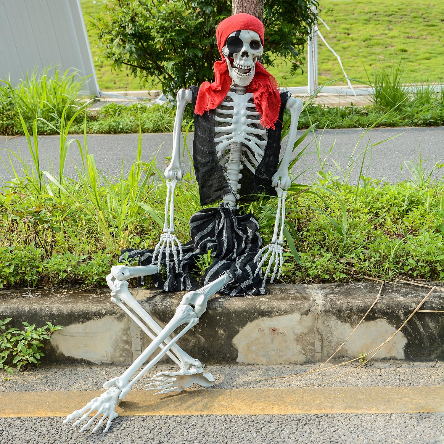 SUNREEK pirate skeleton next to chair to show true-to-life 5.4ft scale