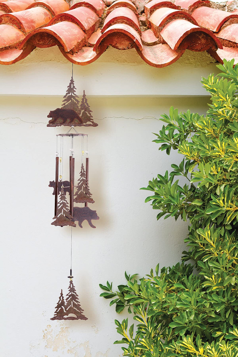 Sunset Vista Designs chime hanging on porch creating peaceful outdoor ambiance