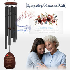 Suntimber wind catcher detail with printed cardinal and engraved words offering comfort