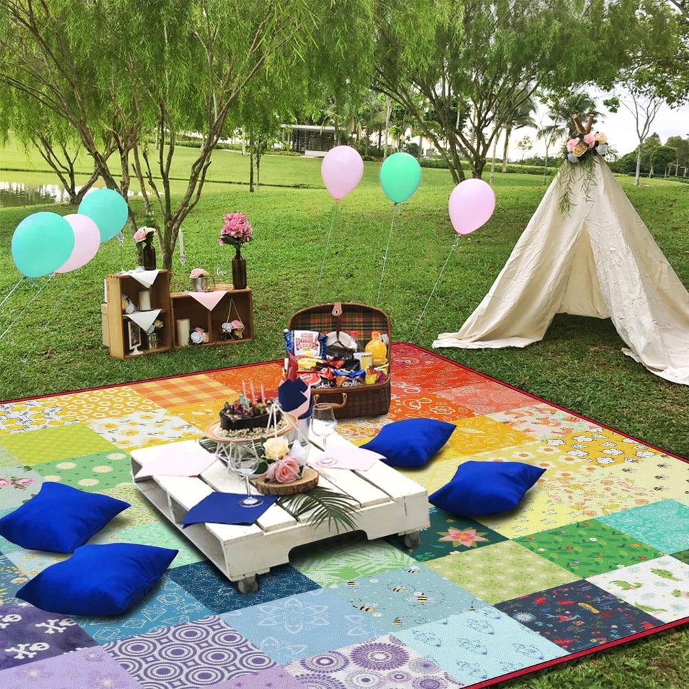 Supfitness blanket spread on grass with family picnic showing roomy capacity