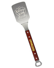 Surreal Entertainment close-up of Krabby Patty metal spatula blade, durable flipping benefit