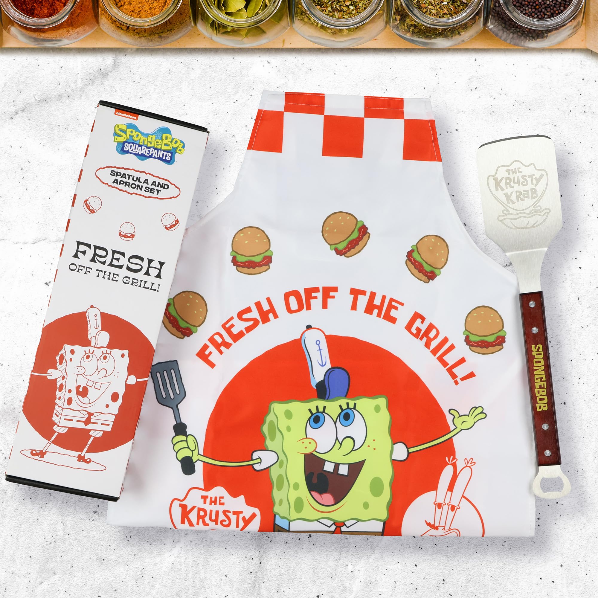 Surreal Entertainment apron front showing SpongeBob flipping Krabby Patties, fun protection