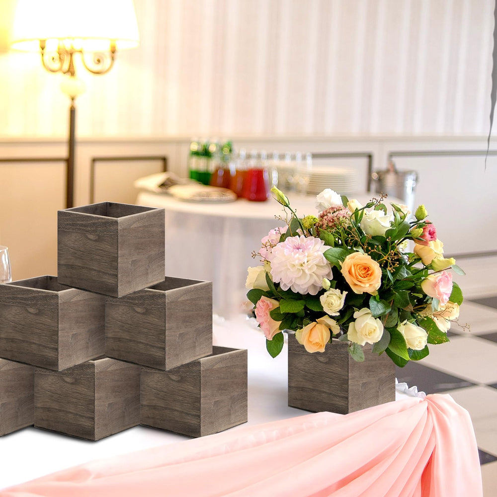 Suzile tabletop centerpiece in use showing styled faux flowers and charm