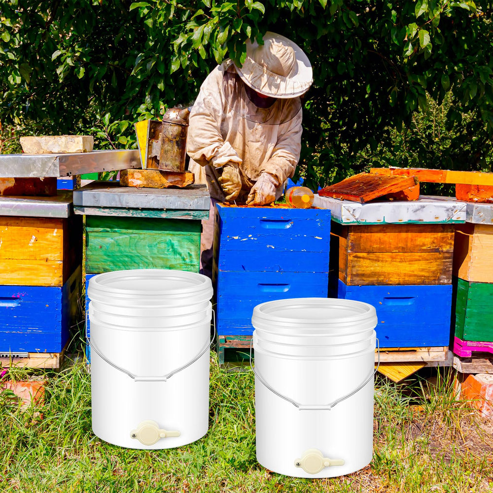 Suzile bucket next to standard honey jar showing 20L scale and easier bottling workflow