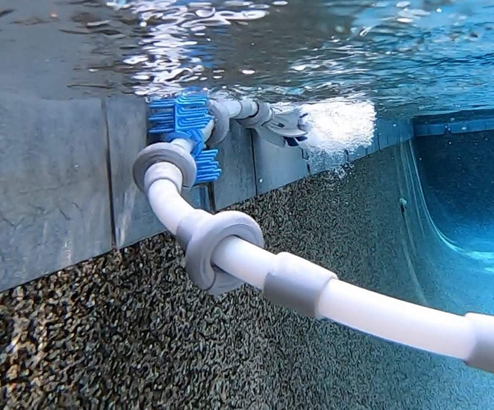 SWASHER tail sweep installed in pool showing reduced spray and cleaner performance
