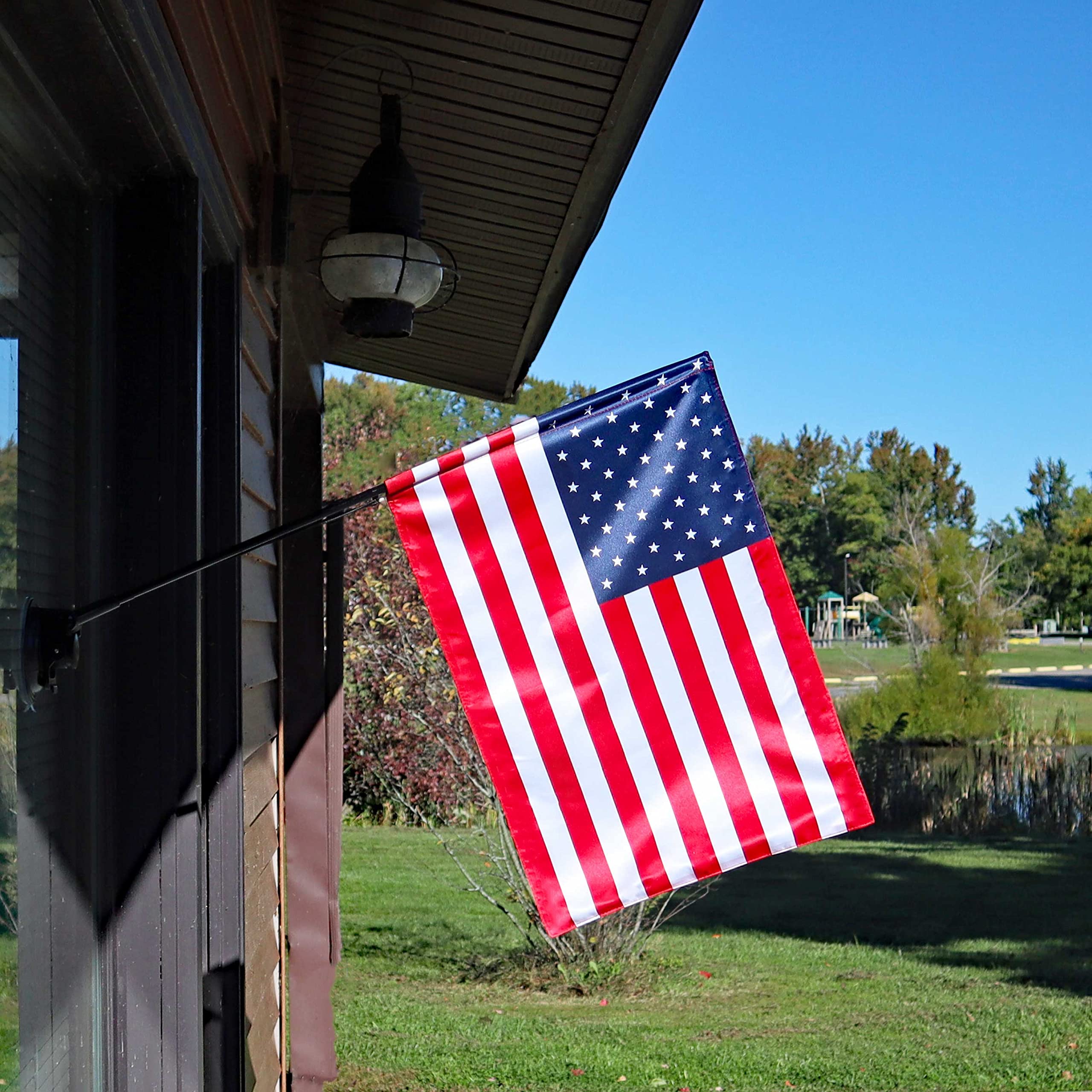 SWEETMERCH CREATIONS flag mounted on RV showing clear visibility while parked