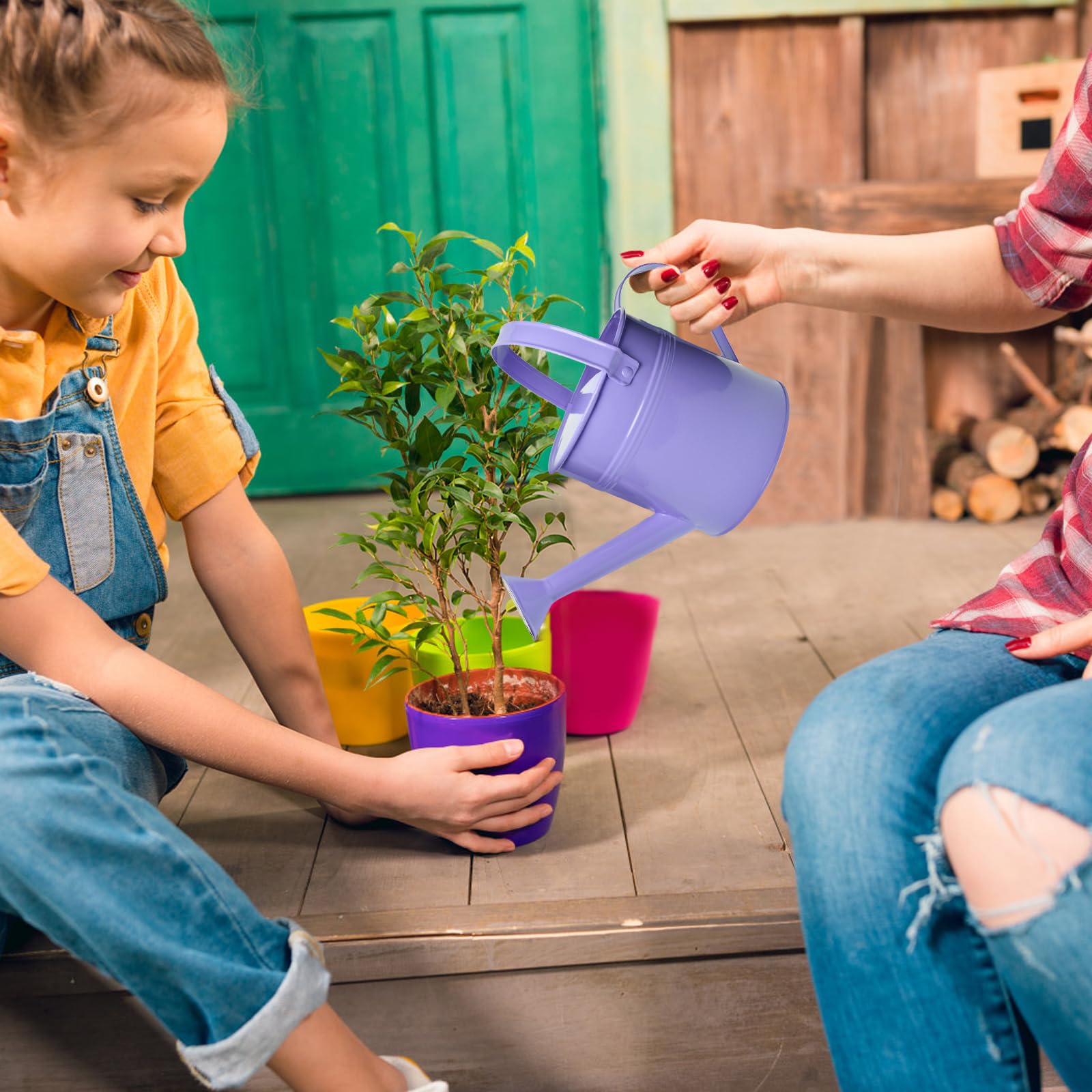 TAKMA watering a hanging basket showing reach and reduced leaf wetting benefit
