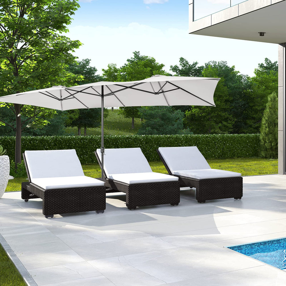 Tangkula umbrella next to a chair showing scale and generous coverage