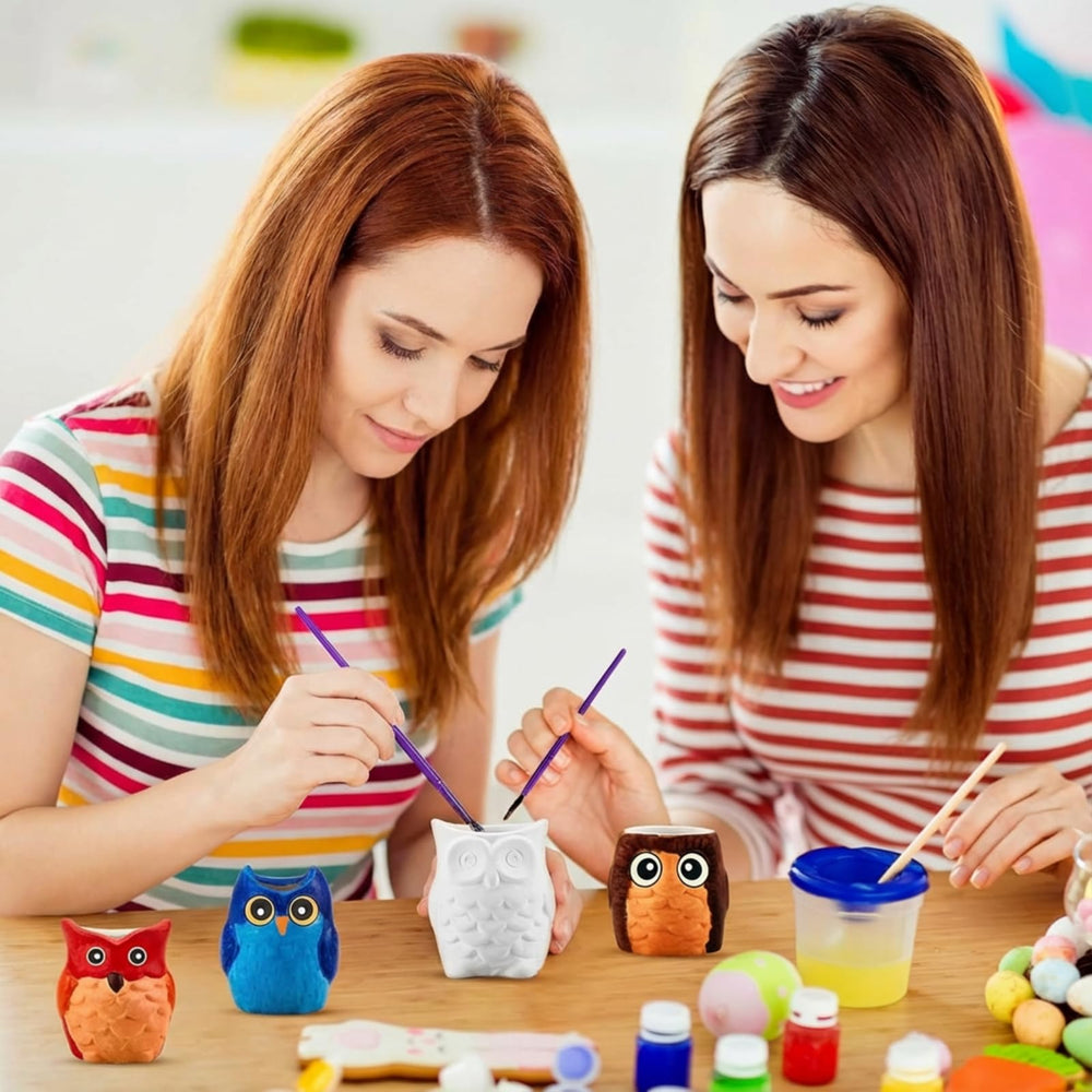 Tanlade group painting session with multiple pots for classroom craft engagement