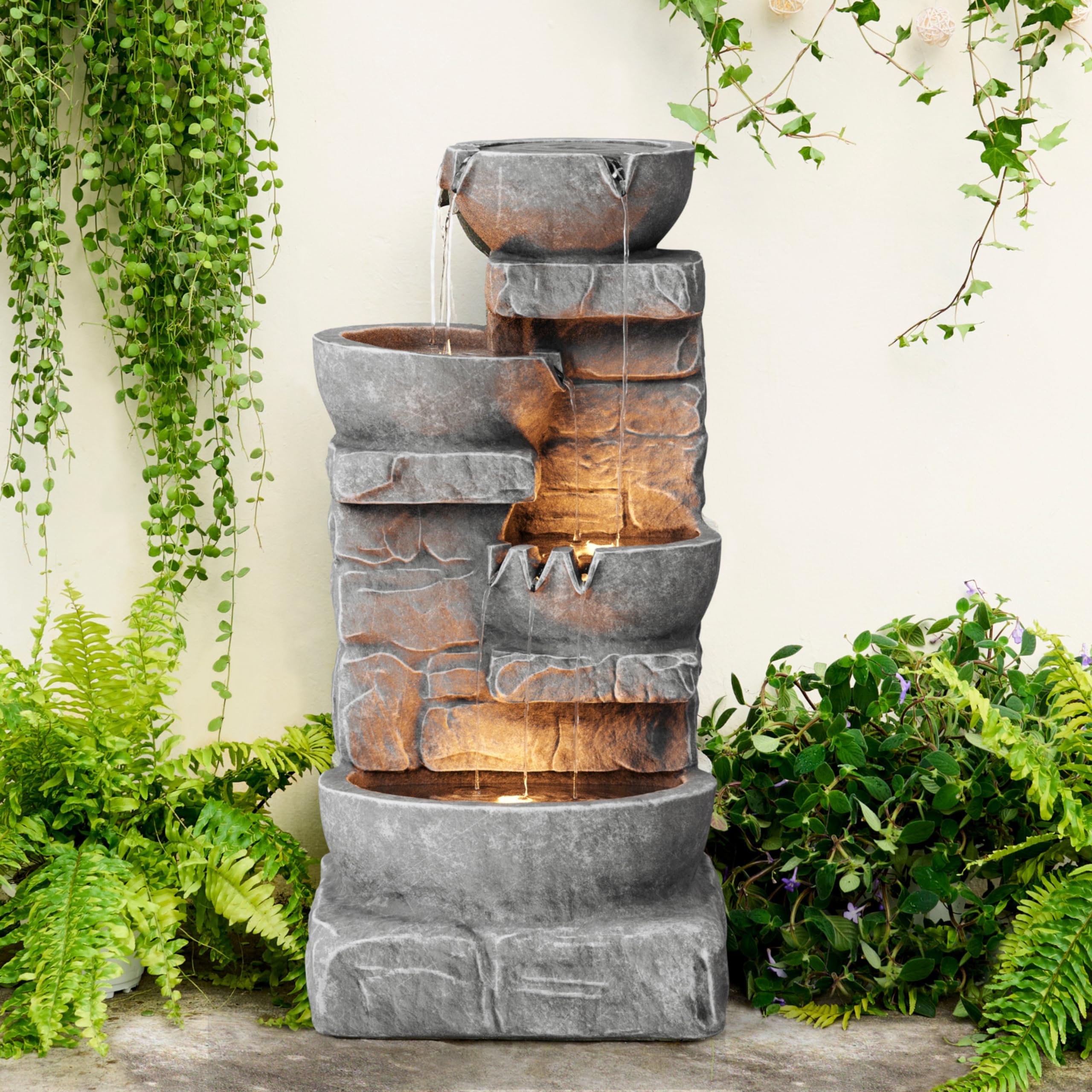 Teamson Home fountain placed in garden to improve landscape ambiance and calm