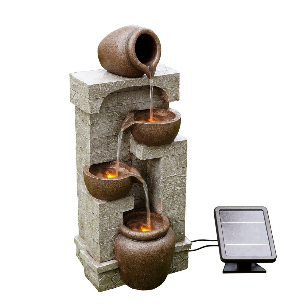 Teamson Home fountain lit by LEDs at night creating soft ambiance