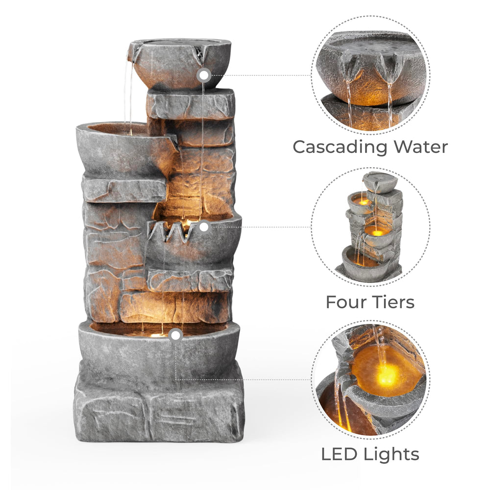 Teamson Home fountain lit by LEDs at night creating warm ambient outdoor lighting