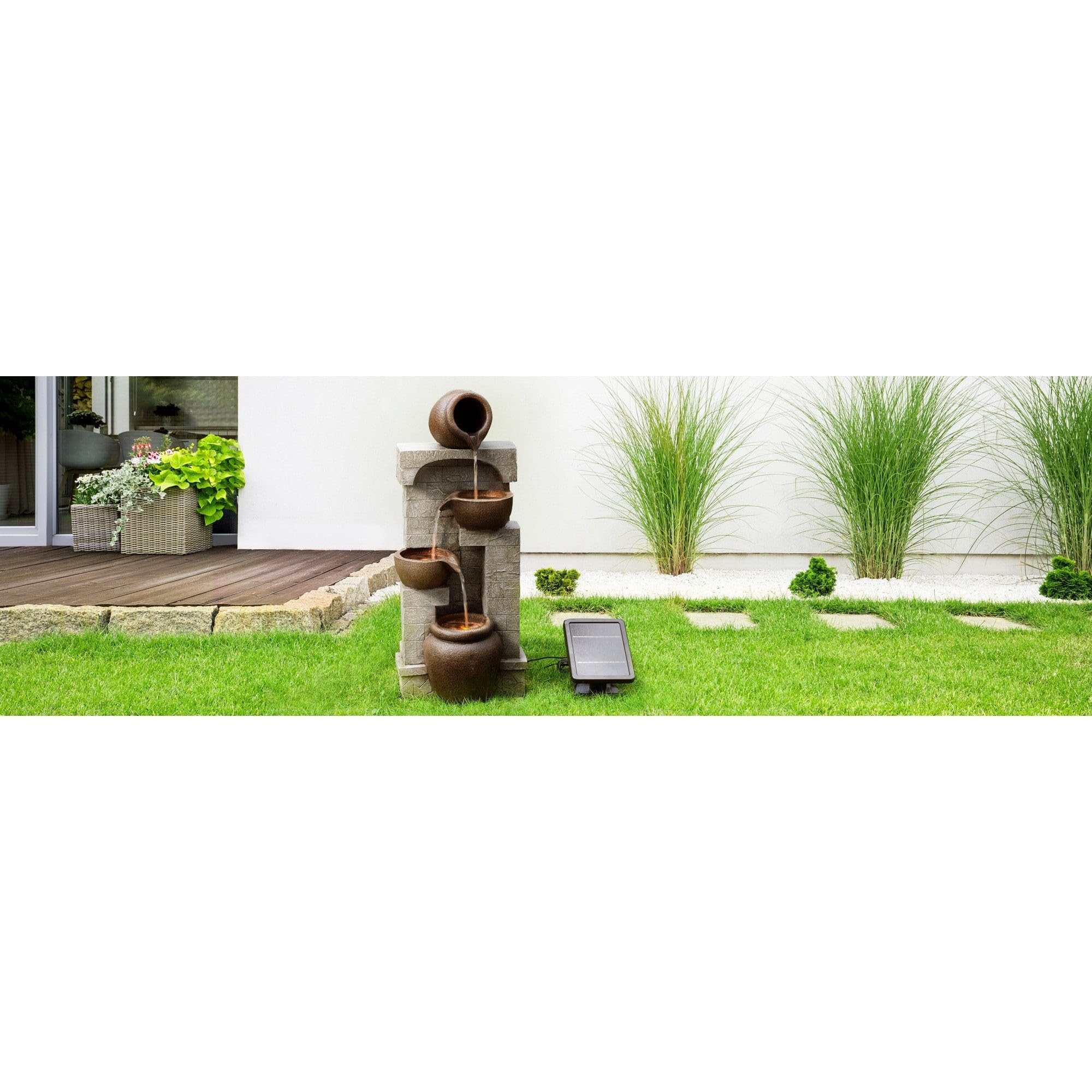 Teamson Home fountain in garden setting adding calm and style