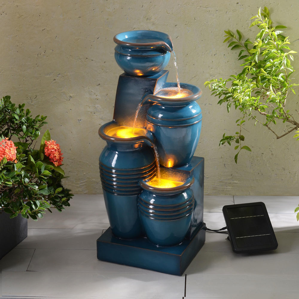 Teamson Home fountain in a patio scene showing how it enhances outdoor living benefit