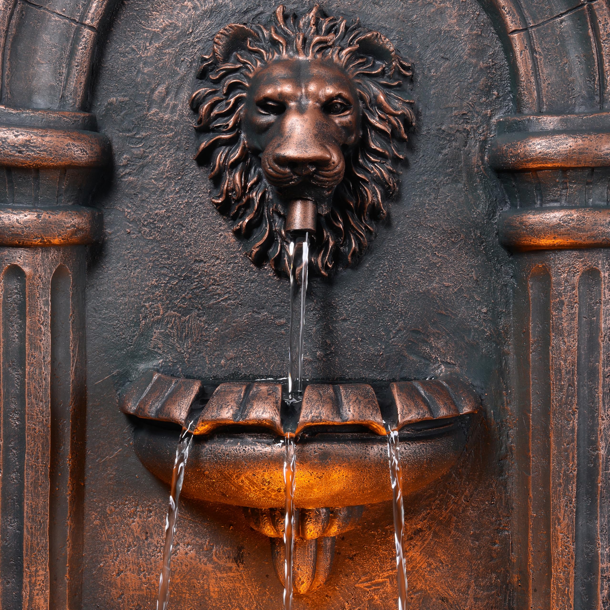 Teamson Home fountain lit by LEDs at dusk to enhance evening ambiance