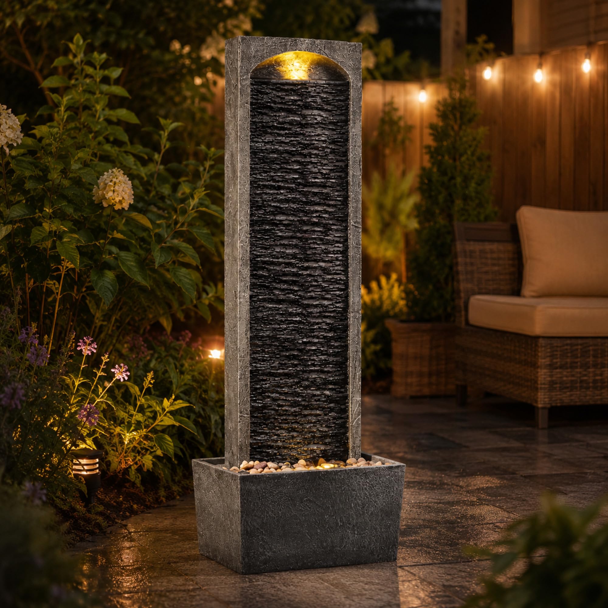 Teamson Home fountain on a wood deck lifestyle shot offering tranquil outdoor ambiance
