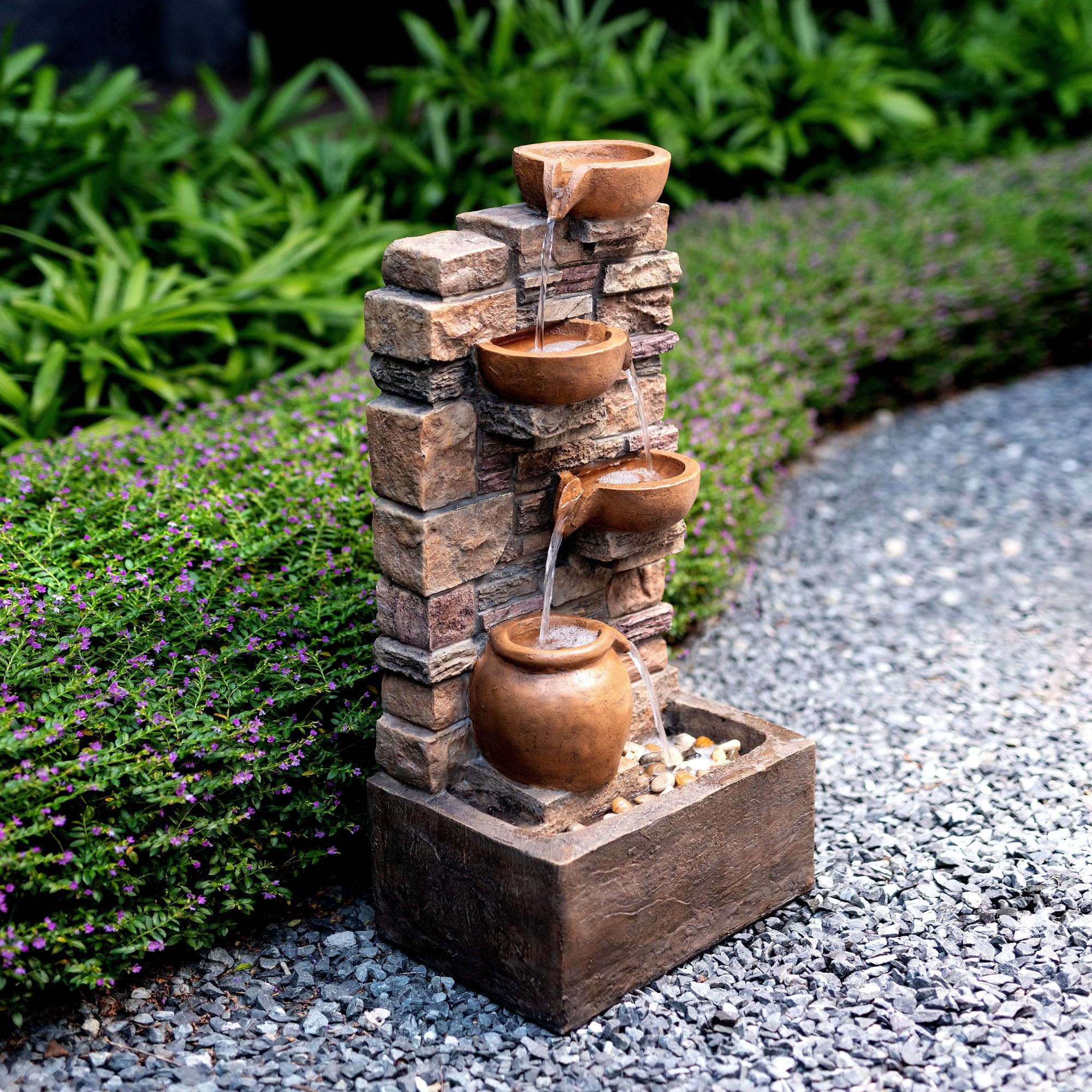 Teamson Home fountain next to outdoor chair to demonstrate scale and easy placement