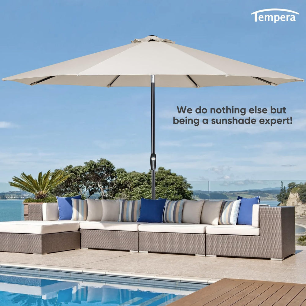 Tempera umbrella next to table showing 10ft size coverage for seating
