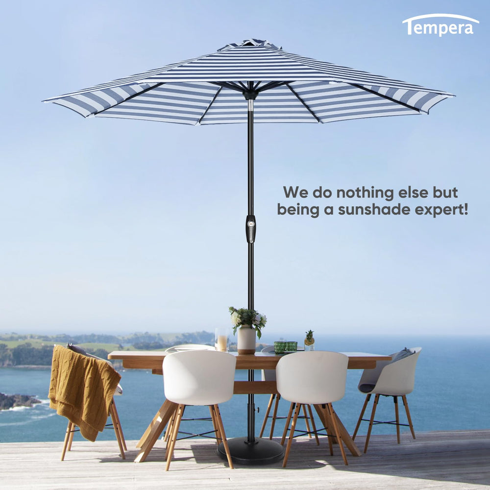 tempera umbrella next to 48-inch table showing 9ft coverage for four to six