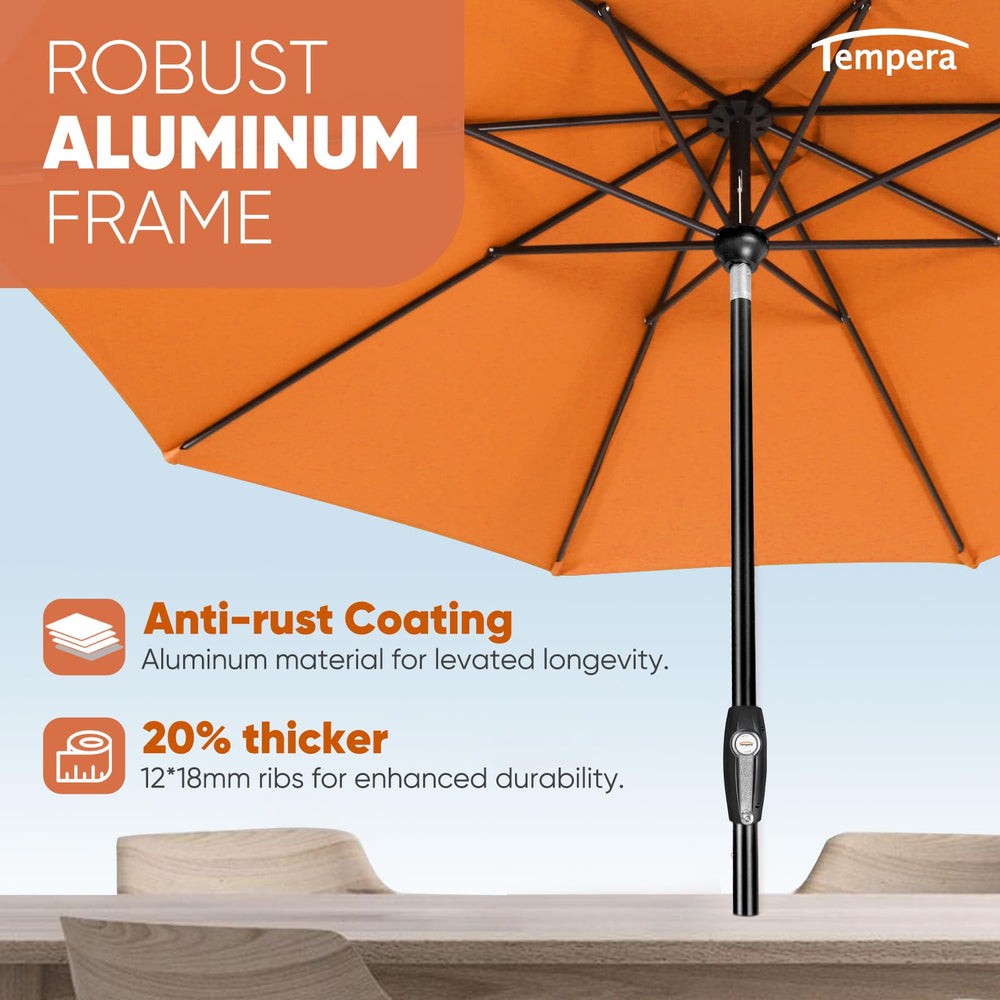 Tempera umbrella shading patio dining set for comfortable outdoor meals