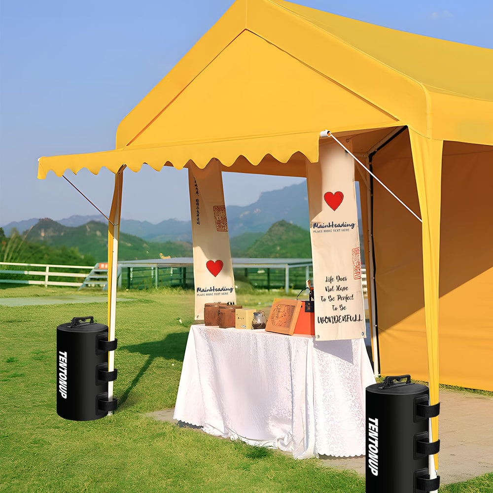TENTONUP four water weight bags anchoring a pop-up canopy at an outdoor event