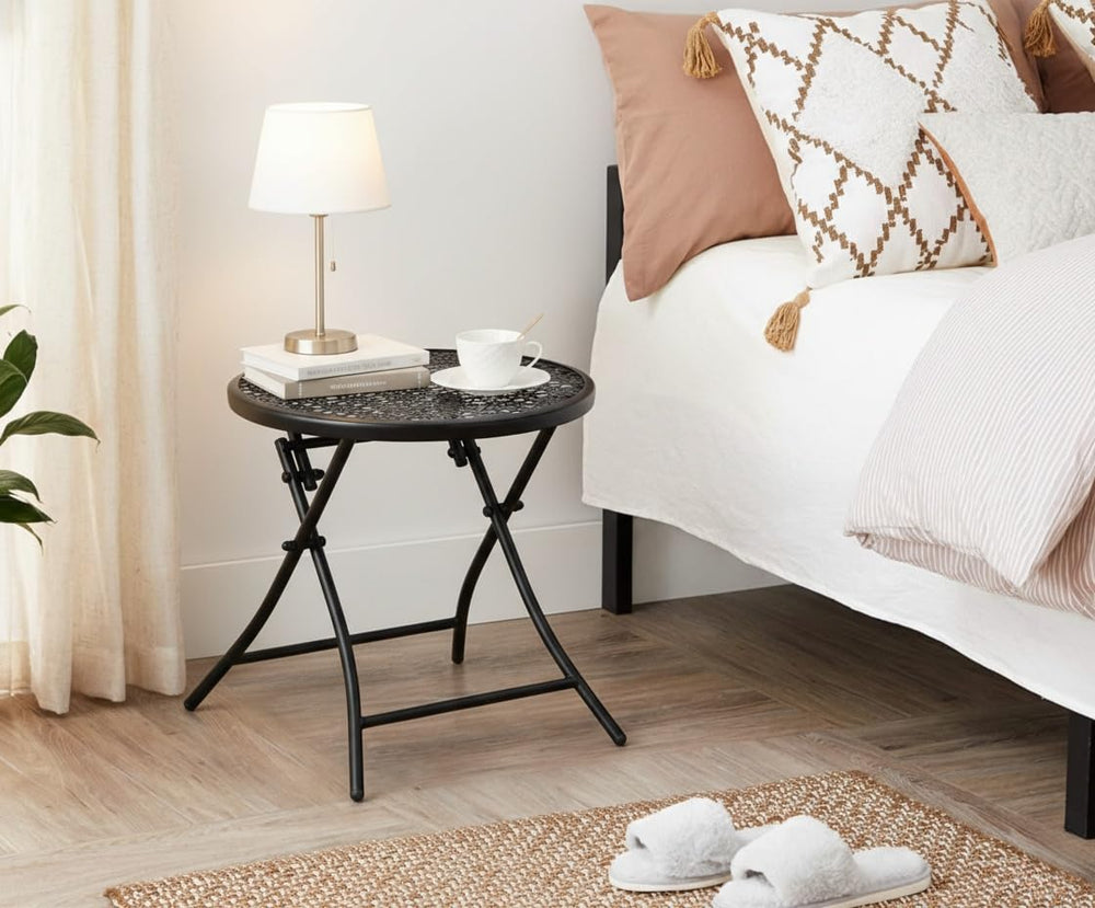 TeoKJ table folded flat stored under a sofa demonstrating easy compact storage
