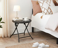 TeoKJ table folded flat stored under a sofa demonstrating easy compact storage