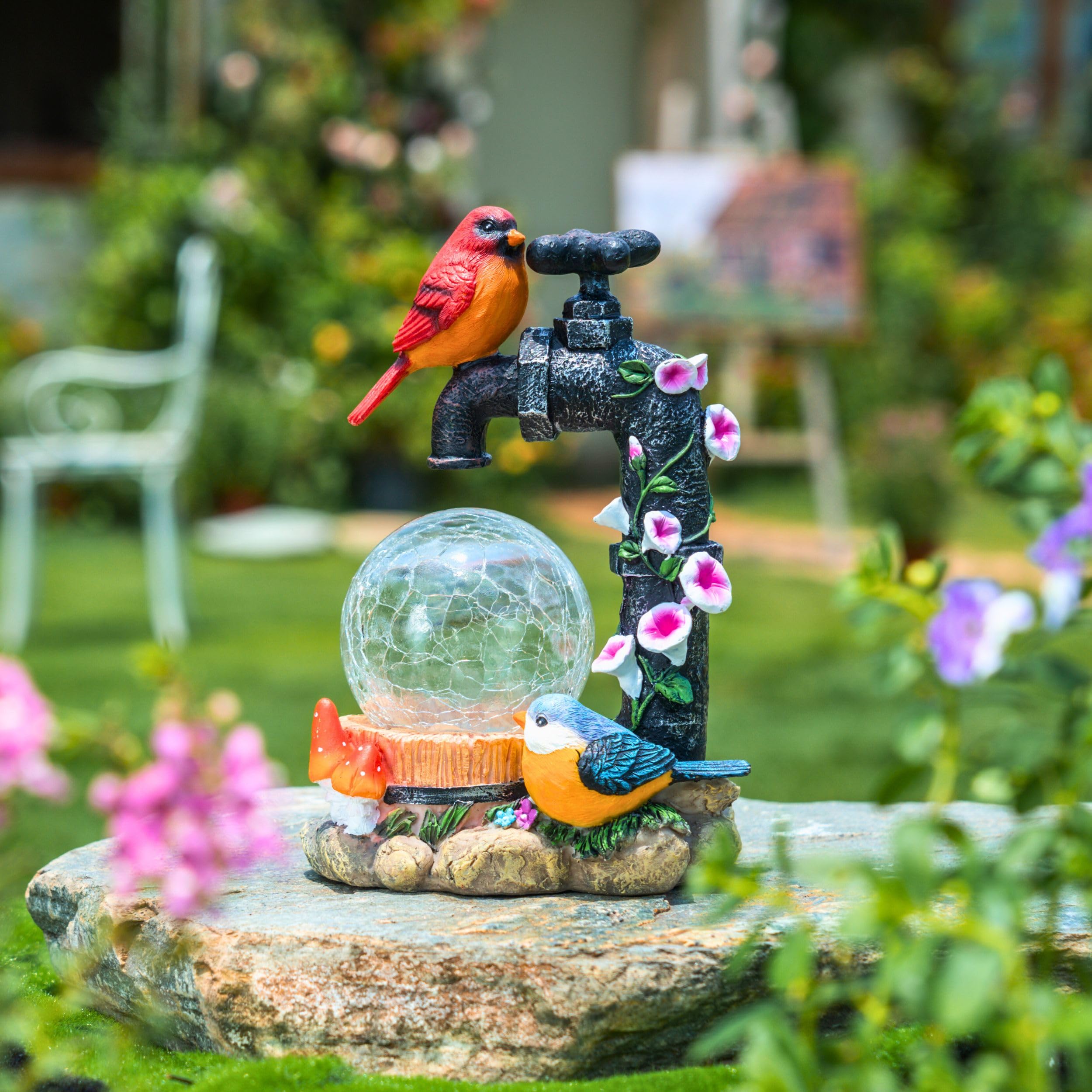 TERESA'S COLLECTIONS cardinal placed in a plant pot offering colorful focal point and easy placement