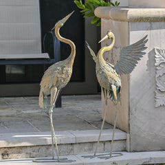 TERESA'S COLLECTIONS side profile of crane installed in flower bed showing weatherproof use