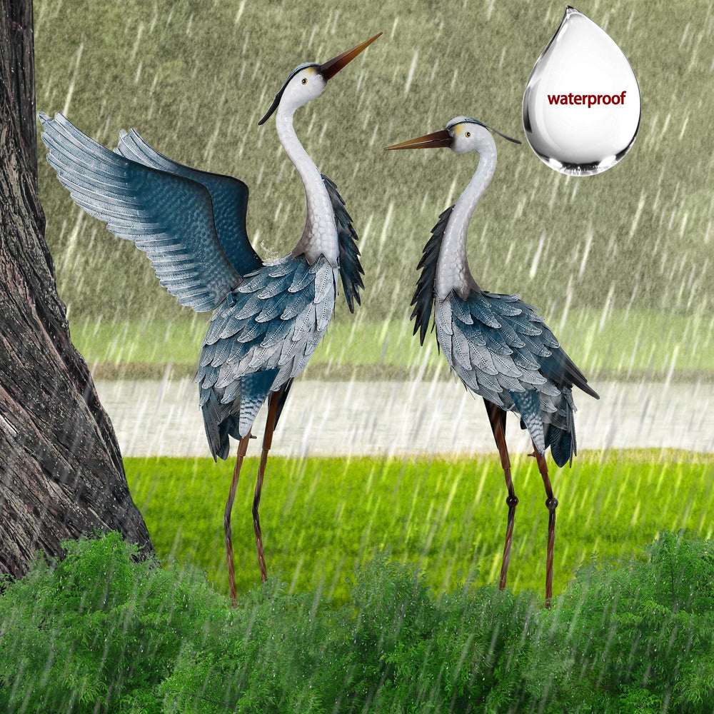 TERESA'S COLLECTIONS herons beside a ruler for scale showing approximate 23–25 inch height