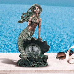 TERESA'S COLLECTIONS close-up of shell pearl solar light highlighting glow