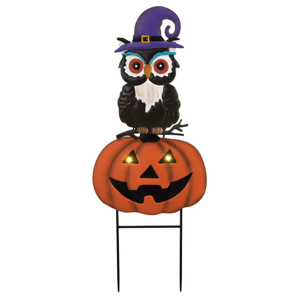 TERESA'S COLLECTIONS illuminated at night highlighting glowing pumpkin eyes for safety