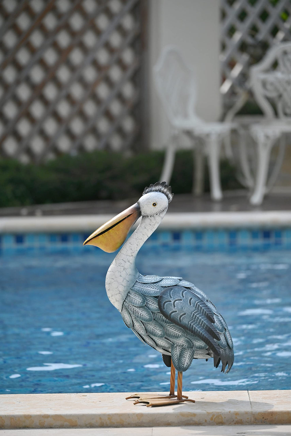 TERESA'S COLLECTIONS pelican next to chair showing 16.5-inch size