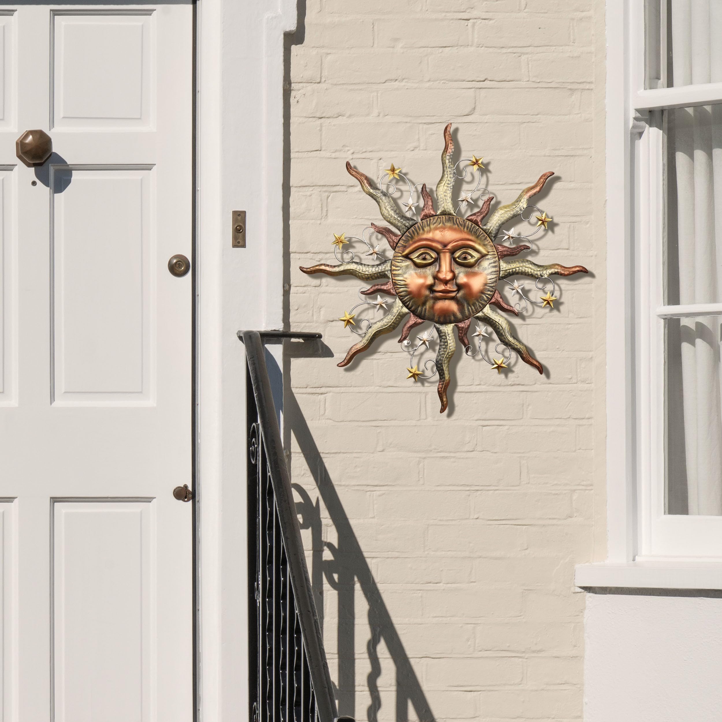 TERESA'S COLLECTIONS sun face hung on fence for instant outdoor styling