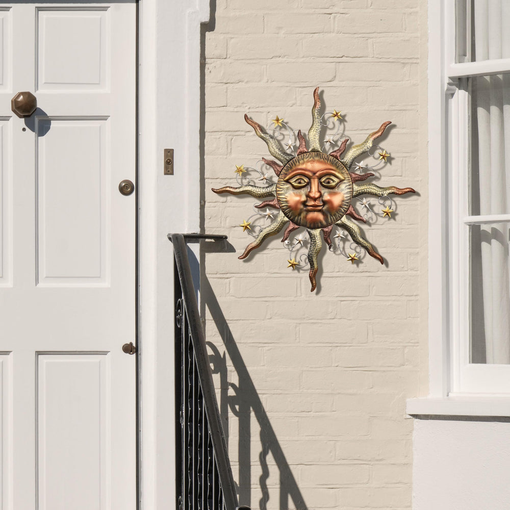 TERESA'S COLLECTIONS sun face hung on fence for instant outdoor styling