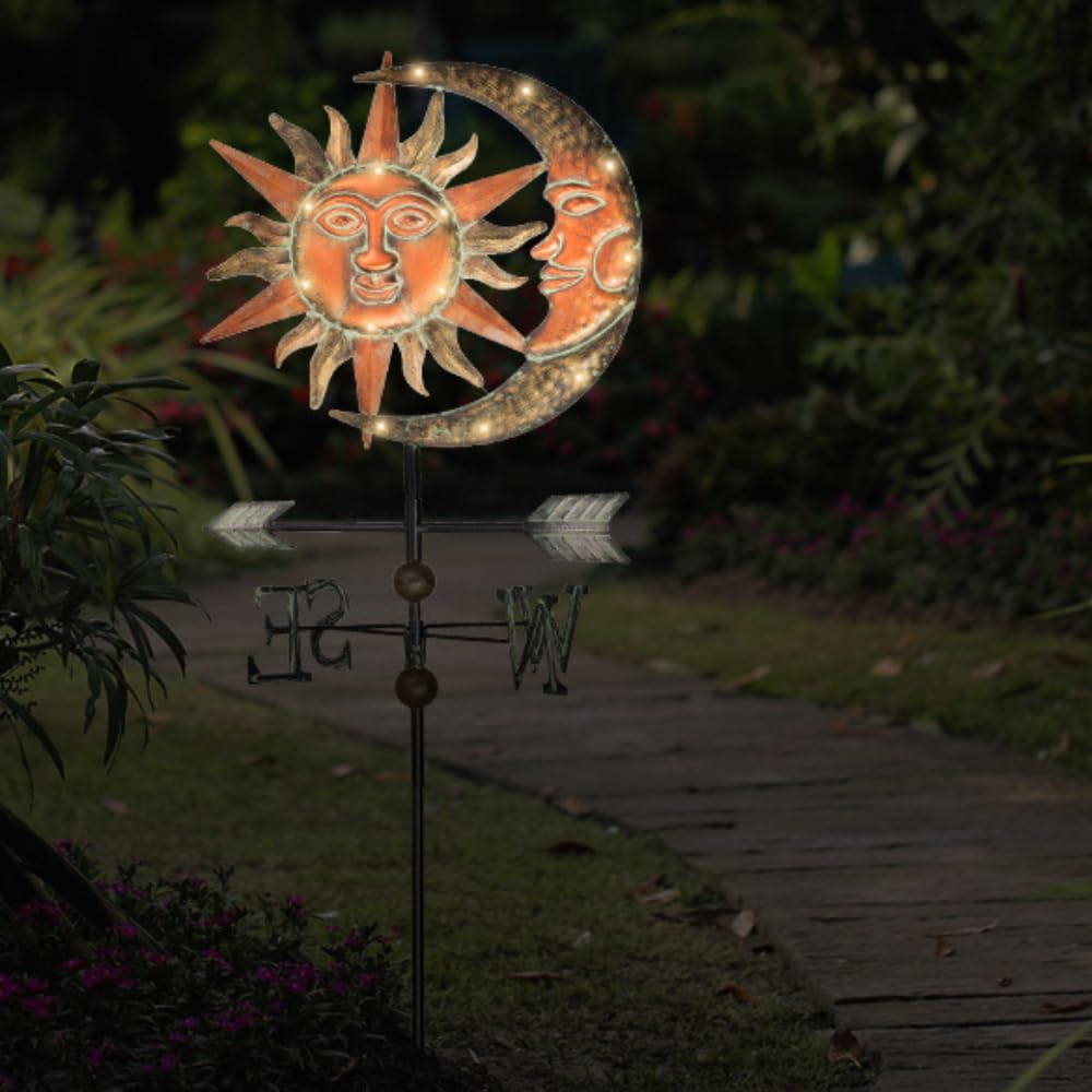 TERESA'S COLLECTIONS installed in a flower bed providing ambient solar-lit charm and curb appeal
