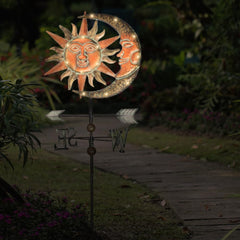 TERESA'S COLLECTIONS installed in a flower bed providing ambient solar-lit charm and curb appeal