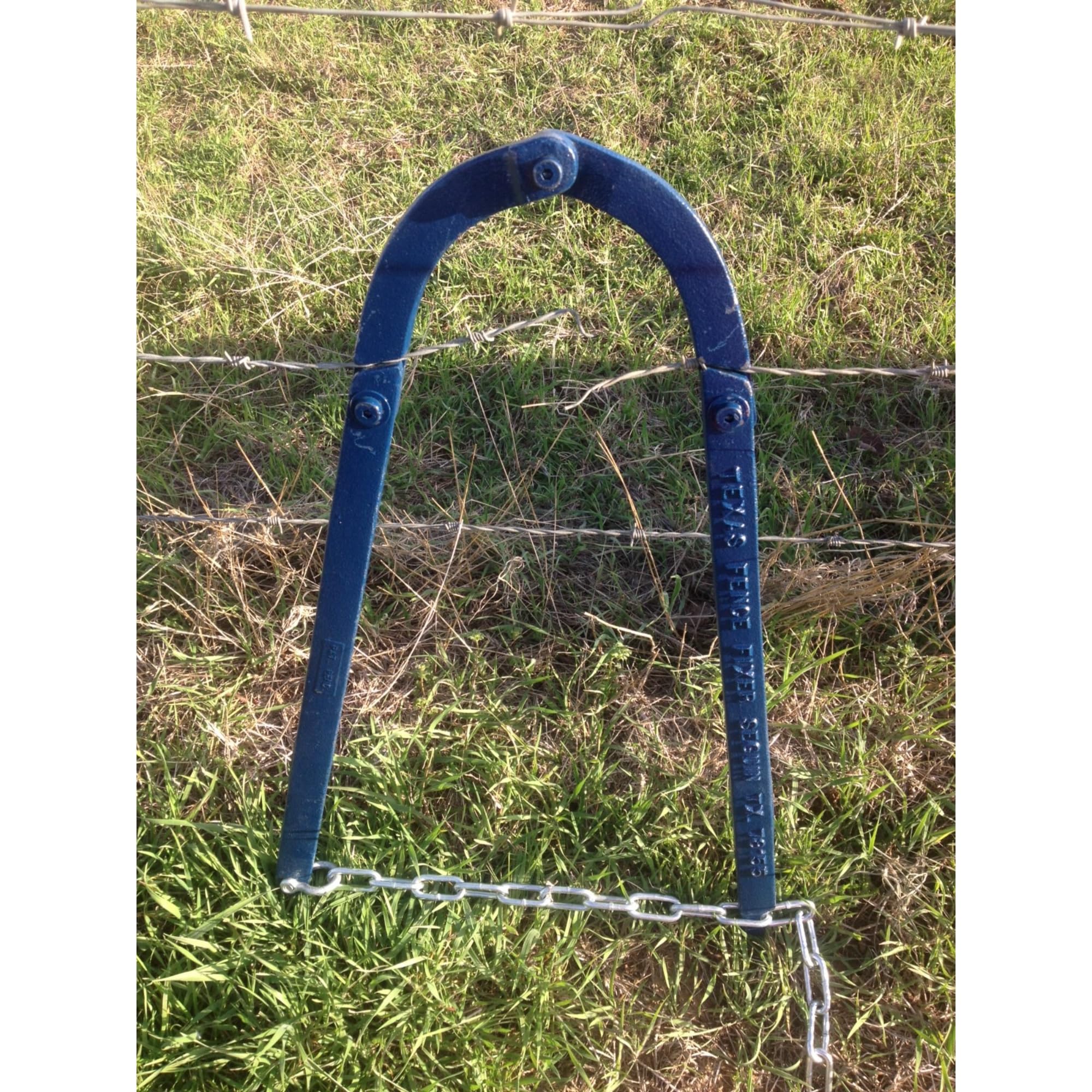 TEXAS FENCE FIXER SEGUIN TX attached to fence post at watergap for quick closure