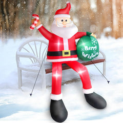 Thanger Santa perched on a roof in a yard setting adding festive curb appeal