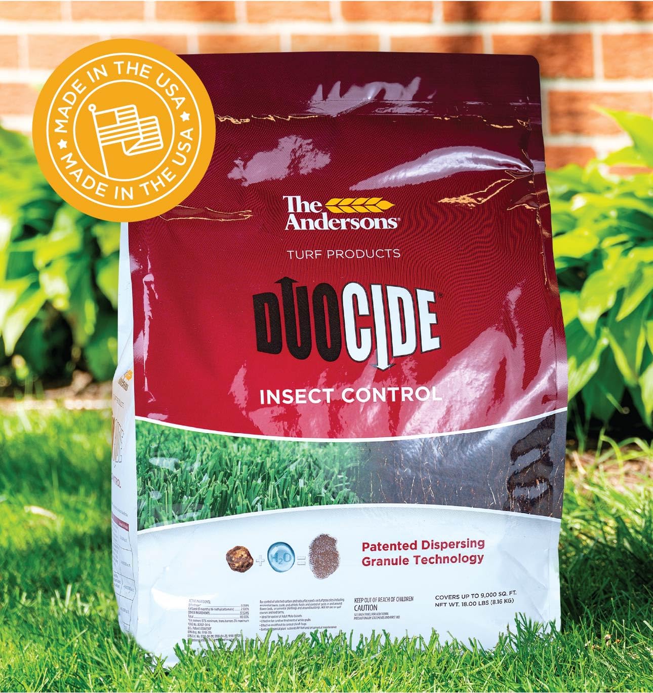 An 18 lb The Andersons DuoCide bag next to a yard for scale