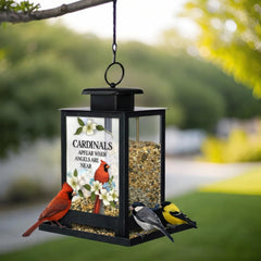 The Bridge Collection hung in a garden inviting birds and creating a soothing outdoor memorial
